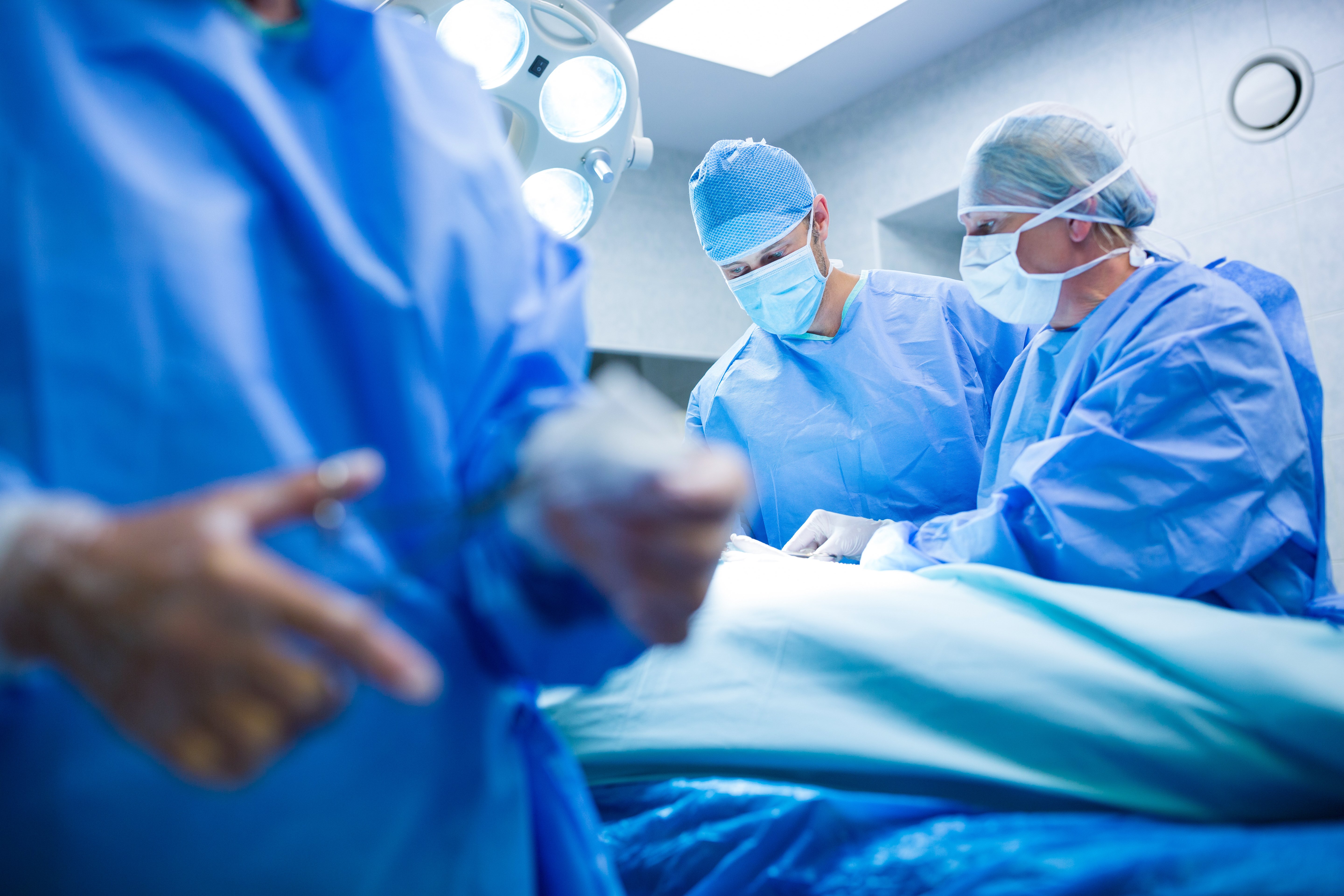 surgeons-performing-operation-operation-room
